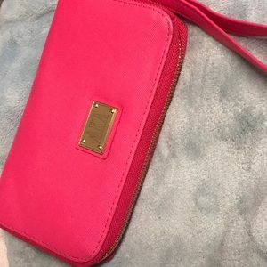 AKA small pink  WRISTLET Sleek design for carrying your essentials